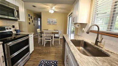 This two-bedroom, two-bathroom home with a two-car garage is on Royal Oaks Golf Club in Florida - for sale on GolfHomes.com, golf home, golf lot