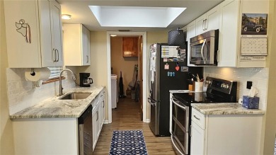 This two-bedroom, two-bathroom home with a two-car garage is on Royal Oaks Golf Club in Florida - for sale on GolfHomes.com, golf home, golf lot