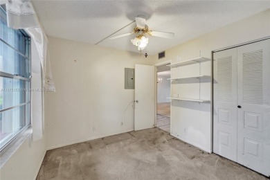 ENJOY ENDLESS GOLF COURSE VIEWS FROM YOUR FIRST FLOOR CONDO WITH on  in Florida - for sale on GolfHomes.com, golf home, golf lot