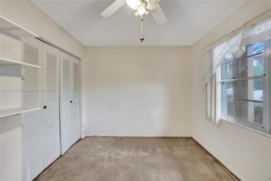 ENJOY ENDLESS GOLF COURSE VIEWS FROM YOUR FIRST FLOOR CONDO WITH on  in Florida - for sale on GolfHomes.com, golf home, golf lot
