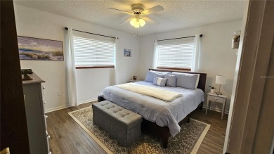 This two-bedroom, two-bathroom home with a two-car garage is on Royal Oaks Golf Club in Florida - for sale on GolfHomes.com, golf home, golf lot