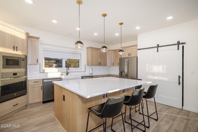 This property is engineered for exceptional STR performance on Headwaters Golf Course At Granby Ranch in Colorado - for sale on GolfHomes.com, golf home, golf lot