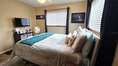 This two-bedroom, two-bathroom home with a two-car garage is on Royal Oaks Golf Club in Florida - for sale on GolfHomes.com, golf home, golf lot