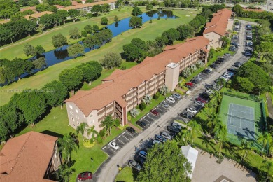 ENJOY ENDLESS GOLF COURSE VIEWS FROM YOUR FIRST FLOOR CONDO WITH on  in Florida - for sale on GolfHomes.com, golf home, golf lot