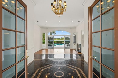 This Custom-built residence is thoughtfully designed to capture on The Loxahatchee Club in Florida - for sale on GolfHomes.com, golf home, golf lot