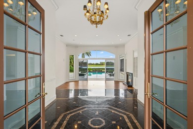 This Custom-built residence is thoughtfully designed to capture on The Loxahatchee Club in Florida - for sale on GolfHomes.com, golf home, golf lot