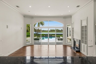 This Custom-built residence is thoughtfully designed to capture on The Loxahatchee Club in Florida - for sale on GolfHomes.com, golf home, golf lot