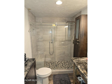 Experience effortless mountain living in this beautifully on Headwaters Golf Course At Granby Ranch in Colorado - for sale on GolfHomes.com, golf home, golf lot