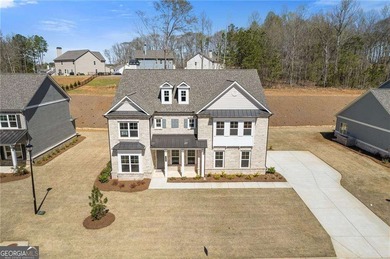 Nestled in the sought-after Traditions of Braselton community on Traditions of Braselton Golf Club in Georgia - for sale on GolfHomes.com, golf home, golf lot