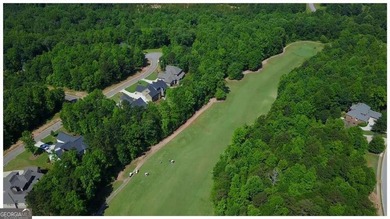Nestled in the sought-after Traditions of Braselton community on Traditions of Braselton Golf Club in Georgia - for sale on GolfHomes.com, golf home, golf lot