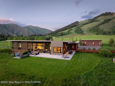 Perched above the Snake River with commanding views of Wolf on Snake River Sporting Club in Wyoming - for sale on GolfHomes.com, golf home, golf lot