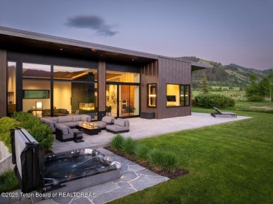 Perched above the Snake River with commanding views of Wolf on Snake River Sporting Club in Wyoming - for sale on GolfHomes.com, golf home, golf lot