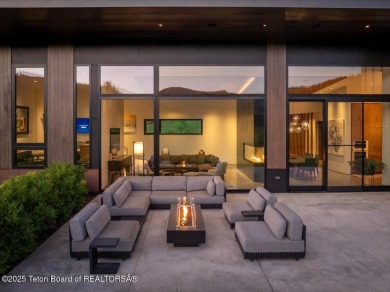 Perched above the Snake River with commanding views of Wolf on Snake River Sporting Club in Wyoming - for sale on GolfHomes.com, golf home, golf lot
