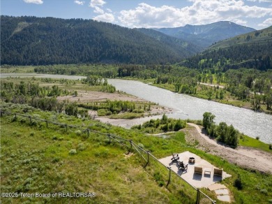 Perched above the Snake River with commanding views of Wolf on Snake River Sporting Club in Wyoming - for sale on GolfHomes.com, golf home, golf lot
