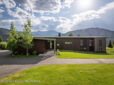 Perched above the Snake River with commanding views of Wolf on Snake River Sporting Club in Wyoming - for sale on GolfHomes.com, golf home, golf lot
