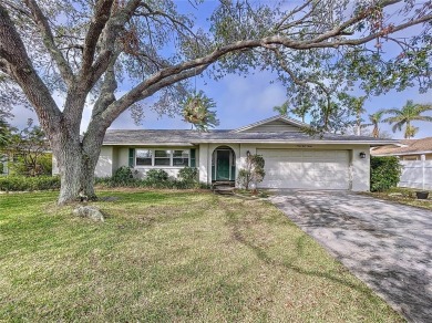 Charming 3-Bedroom Solar Heated Pool Home with Golf Course Views on Seminole Lake Country Club in Florida - for sale on GolfHomes.com, golf home, golf lot