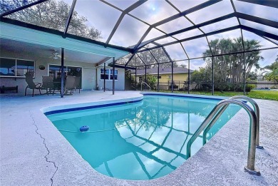 Charming 3-Bedroom Solar Heated Pool Home with Golf Course Views on Seminole Lake Country Club in Florida - for sale on GolfHomes.com, golf home, golf lot