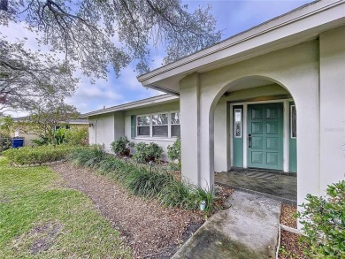 Charming 3-Bedroom Solar Heated Pool Home with Golf Course Views on Seminole Lake Country Club in Florida - for sale on GolfHomes.com, golf home, golf lot