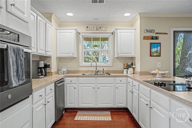 This precious patio home offers stunning views of the lagoon and on  in Georgia - for sale on GolfHomes.com, golf home, golf lot