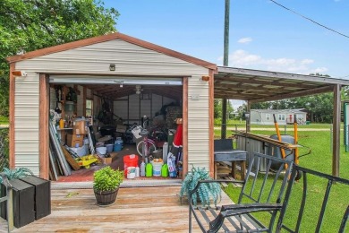 HOME, BOAT , GOLF CART AND MULTIPLE STORAGE BUILDINGS CAN BE ALL on Sapelo Hammock Golf Club in Georgia - for sale on GolfHomes.com, golf home, golf lot