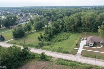 Situated on .8 acres, build your dream home on this vacant land! on Cedar Glen Golf Club in Michigan - for sale on GolfHomes.com, golf home, golf lot