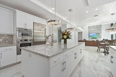 Contemporary Coastal Living in Boca Raton. Stunning Custom Built on Red Reef Executive Golf Course in Florida - for sale on GolfHomes.com, golf home, golf lot