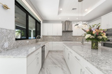 Contemporary Coastal Living in Boca Raton. Stunning Custom Built on Red Reef Executive Golf Course in Florida - for sale on GolfHomes.com, golf home, golf lot