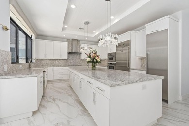 Contemporary Coastal Living in Boca Raton. Stunning Custom Built on Red Reef Executive Golf Course in Florida - for sale on GolfHomes.com, golf home, golf lot