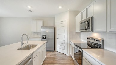 Welcome to your dream home at 17119 Barnwood, nestled in the on Esplanade Golf and Country at Lakewood Ranch in Florida - for sale on GolfHomes.com, golf home, golf lot