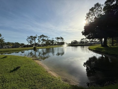 This well-cared for Palm Harbor stucco home provides beautiful on Del Tura Golf and Country Club in Florida - for sale on GolfHomes.com, golf home, golf lot