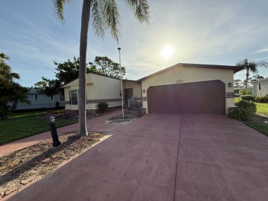 This well-cared for Palm Harbor stucco home provides beautiful on Del Tura Golf and Country Club in Florida - for sale on GolfHomes.com, golf home, golf lot
