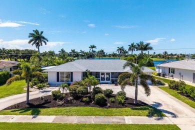 IT IS ALL ABOUT THE LOCATION. This home sits on a lake looking on Island Country Club in Florida - for sale on GolfHomes.com, golf home, golf lot