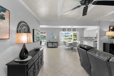IT IS ALL ABOUT THE LOCATION. This home sits on a lake looking on Island Country Club in Florida - for sale on GolfHomes.com, golf home, golf lot