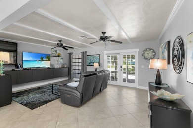IT IS ALL ABOUT THE LOCATION. This home sits on a lake looking on Island Country Club in Florida - for sale on GolfHomes.com, golf home, golf lot
