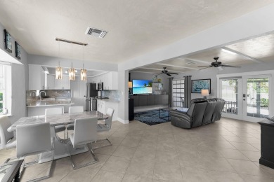 IT IS ALL ABOUT THE LOCATION. This home sits on a lake looking on Island Country Club in Florida - for sale on GolfHomes.com, golf home, golf lot