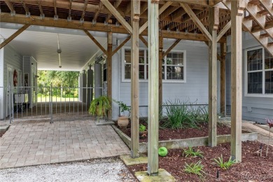 This updated waterfront stilt (DID NOT FLOOD) home in Crystal on Plantation Inn and Golf Resort  in Florida - for sale on GolfHomes.com, golf home, golf lot