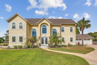 Nestled on the prestigious island green of hole #5, this on Tiger Point Golf and Country Club in Florida - for sale on GolfHomes.com, golf home, golf lot