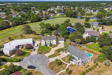 Nestled on the prestigious island green of hole #5, this on Tiger Point Golf and Country Club in Florida - for sale on GolfHomes.com, golf home, golf lot