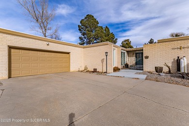 This impeccably maintained single-level mid-century home is on San Juan Country Club in New Mexico - for sale on GolfHomes.com, golf home, golf lot