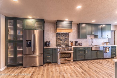 This impeccably maintained single-level mid-century home is on San Juan Country Club in New Mexico - for sale on GolfHomes.com, golf home, golf lot