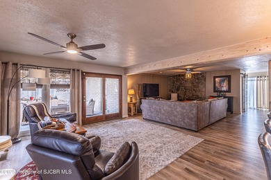 This impeccably maintained single-level mid-century home is on San Juan Country Club in New Mexico - for sale on GolfHomes.com, golf home, golf lot