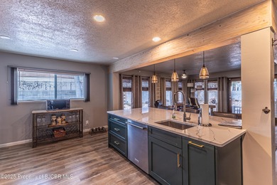 This impeccably maintained single-level mid-century home is on San Juan Country Club in New Mexico - for sale on GolfHomes.com, golf home, golf lot