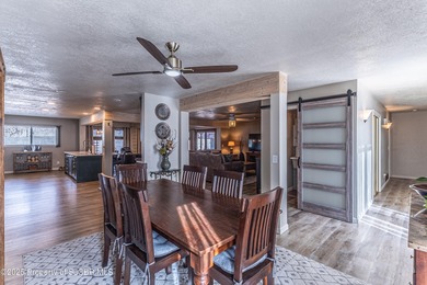 This impeccably maintained single-level mid-century home is on San Juan Country Club in New Mexico - for sale on GolfHomes.com, golf home, golf lot