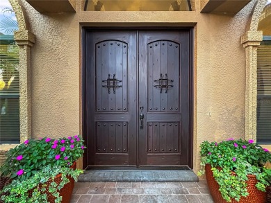 Lovely Meditterrean home welcomes you through rustic double on The Club at Eaglebrooke in Florida - for sale on GolfHomes.com, golf home, golf lot