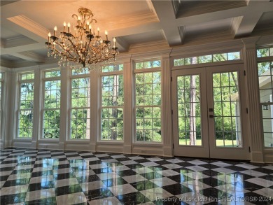 This 4-bedroom, 3.1-bath waterfront property is nestled in the on Gates Four Golf and Country Club in North Carolina - for sale on GolfHomes.com, golf home, golf lot