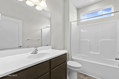 Welcome to the Boardwalk, a stylish, one-level home with modern on Sound Golf Links at Albemarle Plantation in North Carolina - for sale on GolfHomes.com, golf home, golf lot