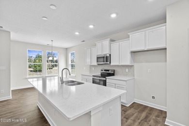 Welcome to the Boardwalk, a stylish, one-level home with modern on Sound Golf Links at Albemarle Plantation in North Carolina - for sale on GolfHomes.com, golf home, golf lot