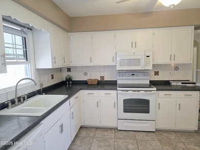 Loads of value in this inviting home backing to River Bend Golf on River Bend Golf and Country Club in North Carolina - for sale on GolfHomes.com, golf home, golf lot