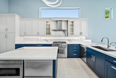 Discover luxury living at 326 Charroux Drive in prestigious on Frenchmans Reserve in Florida - for sale on GolfHomes.com, golf home, golf lot