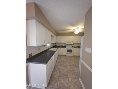 Loads of value in this inviting home backing to River Bend Golf on River Bend Golf and Country Club in North Carolina - for sale on GolfHomes.com, golf home, golf lot